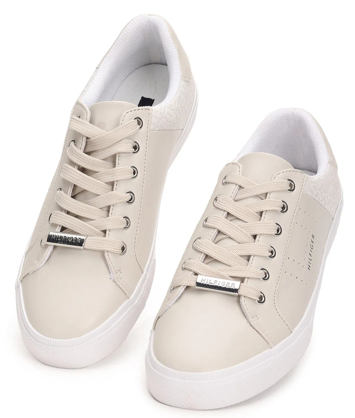 Pair of white sneakers on a white background