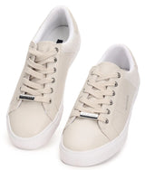 Pair of white sneakers on a white background
